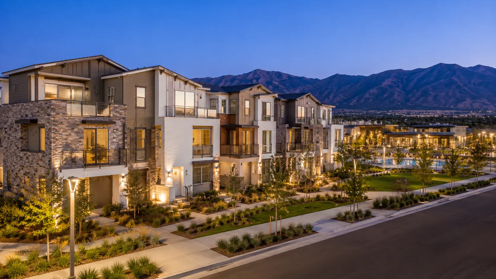 Suburban neighborhood at twilight with mountains