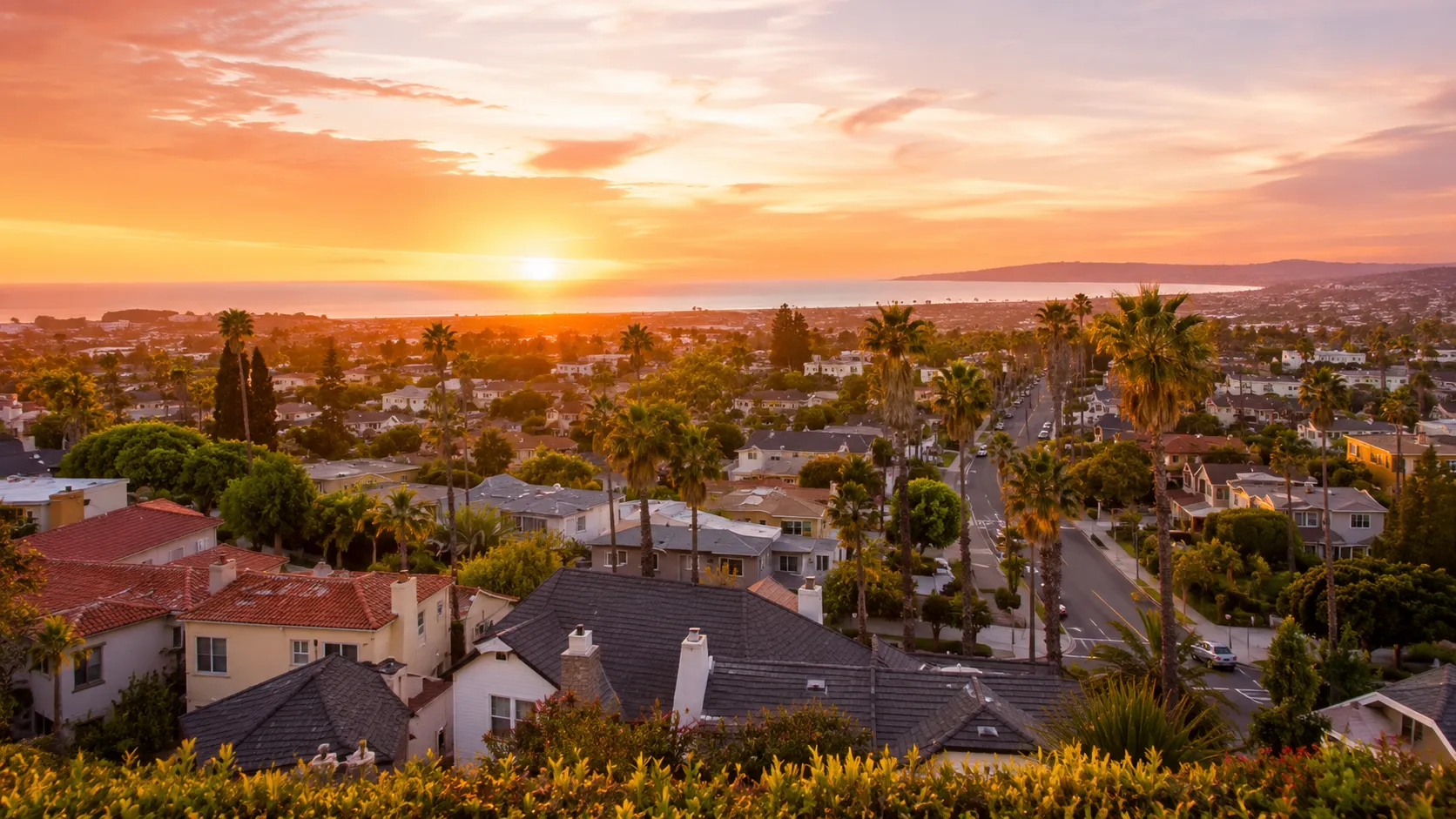 Golden sunset over coastal suburbia